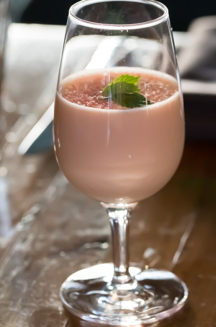 Pink Grasshopper with a mint leaf garnish